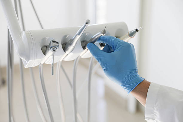 Professional Tooth Extraction technician working in Tice, FL